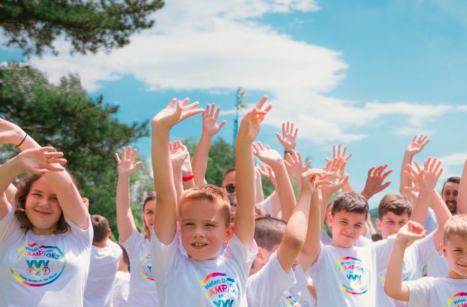 Youth with raised hands celebrating